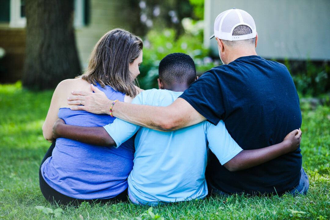 MY SON BELIEVES HE WILL BE KILLED BY POLICE. Ed Hudgins poses with his family in their backyard.