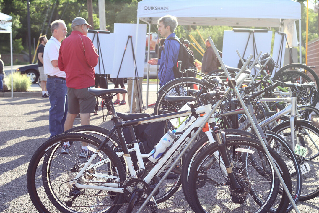 WHEEL TALK. Bicycle enthusiasts gathered for Chippewa Valley Bike Week activities in 2018 across from The Local Store at Volume One World Headquarters.