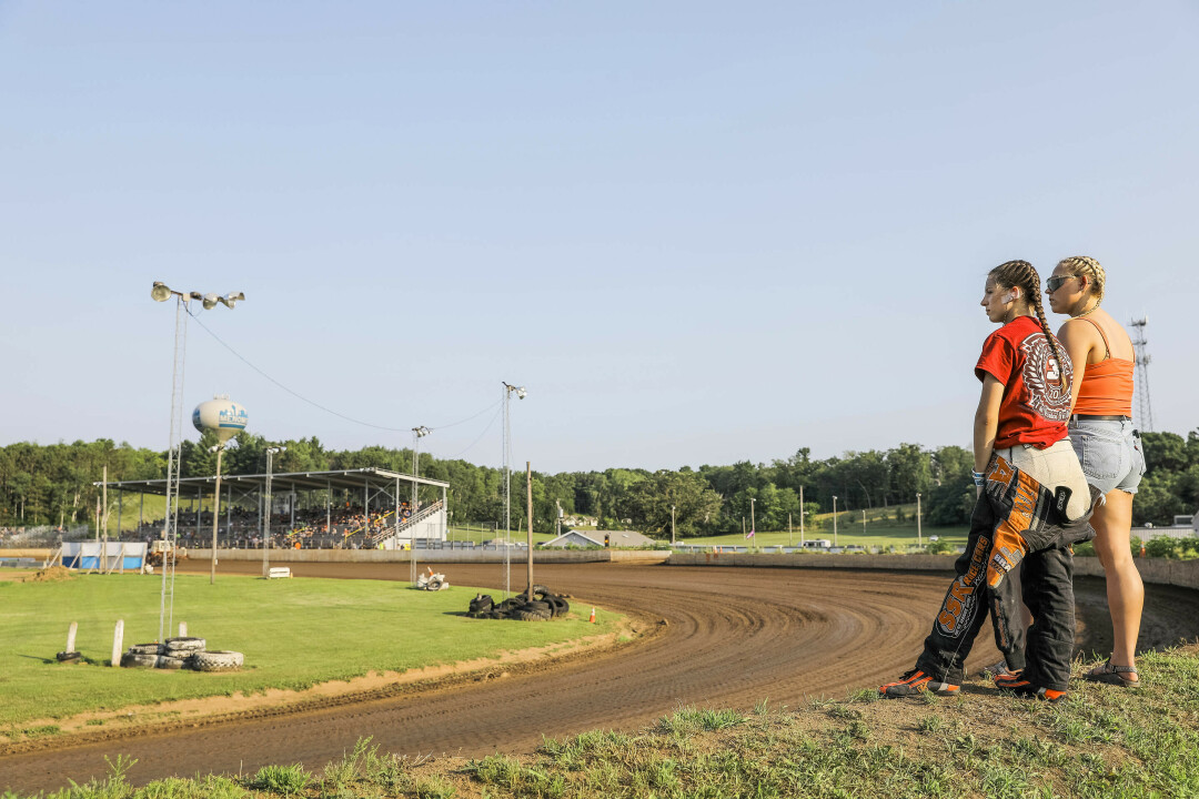 Kennedy takes it easy with her friend Abigail Staves (right) on race day in Menomonie's Red Cedar Speedway (Photo by Andrea Paulseth).