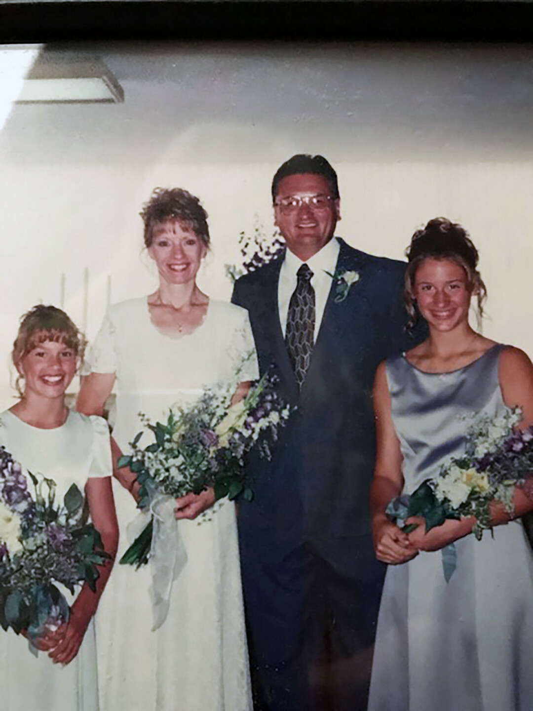 Greg Fahrman on his wedding day to his wife Kathie Fahrman, pictured here with his two daughters Katie and Laura.