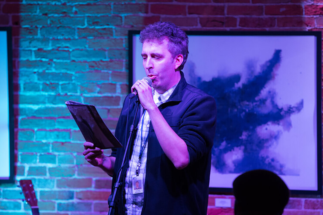 MUNICIPAL WORDSMITH. Ken Szymanski during a reading at the Volume One Gallery.