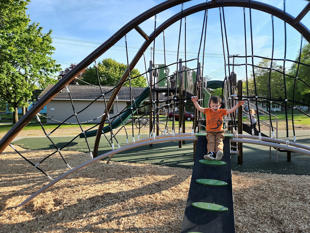 WHEEEE! A local youngster living his best life on the new equipment at Newell Park.