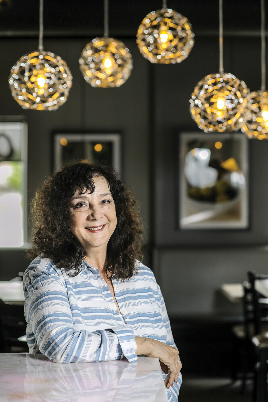 USING HER NOODLE. Joanne Palzkill, shown here at Za 51 in Altoona, says her accounting degree from UW-Eau Claire has been useful in managing the business end of her family’s two restaurants.