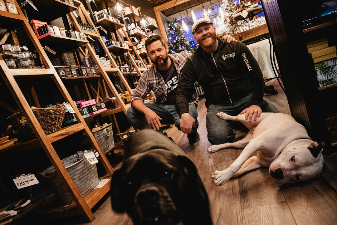 Tony, left, and husband Kevin with their two fur babies Willy (lower left) and Molly. 