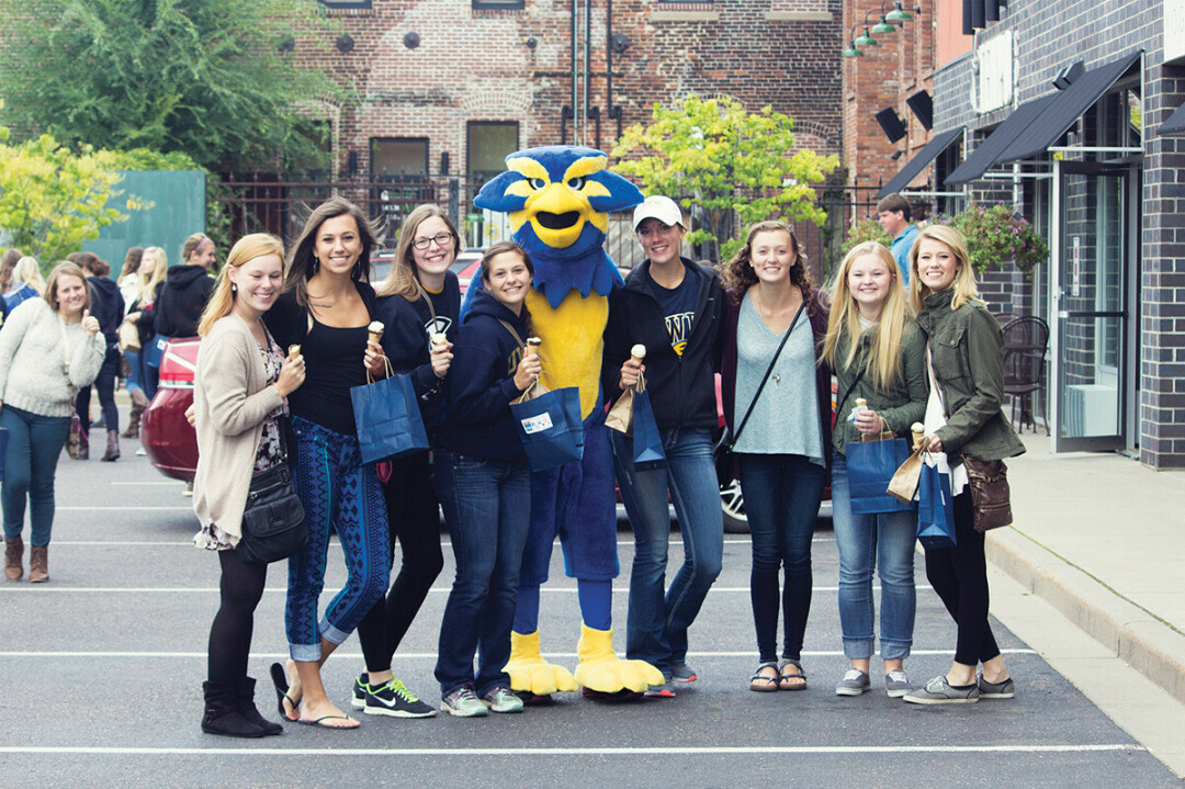 CHILLIN' WITH BLU. Why are these Blugolds smiling? It may be because Eau Claire is relatively affordable compared with many college towns.