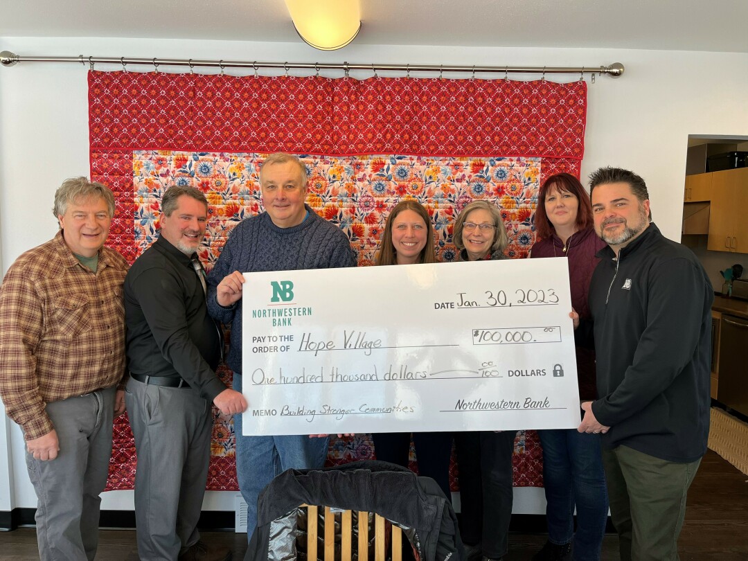 BUILDING HOPE: Northwestern Bank provided funds to Hope Village to build homes for homeless families. Pictured from left: Mike Cohoon, Hope Village executive director; Jamie Leibrandt, Northwestern Bank market president; Dick Hebert, Hope Village board member; Jessica Oleson Bue, Hope Village board member; Gayle Glitzke, Hope Village board member; Tiffany Woghan, Hope Village board member; and Greg Misfeldt, Northwestern Bank vice president of business banking.