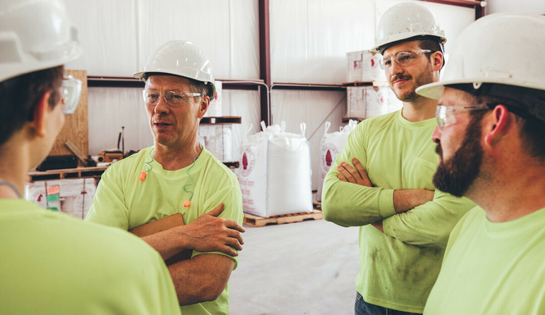 Paul Ayres, second from left, is CEO, owner, and board chairman of Red Flint Group. He's also now a podcaster and business coach. (Submitted photo)