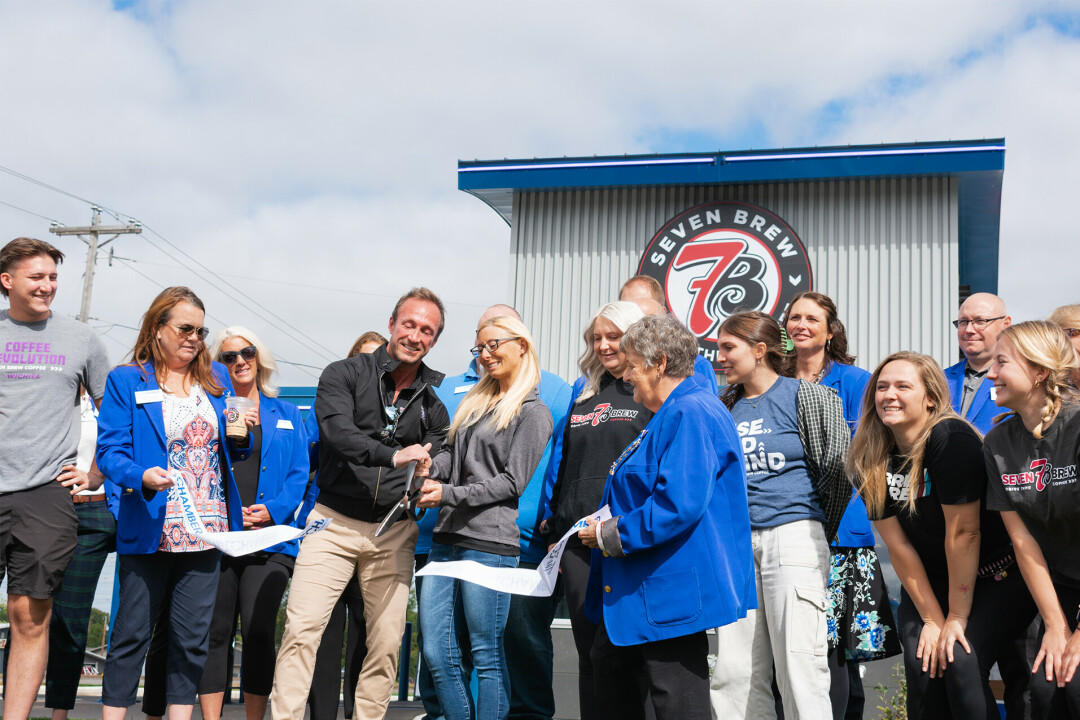 Owners Lippincott and Smith with their staff and Eau Claire Chamber of Commerce members at the ribbon-cutting ceremony.