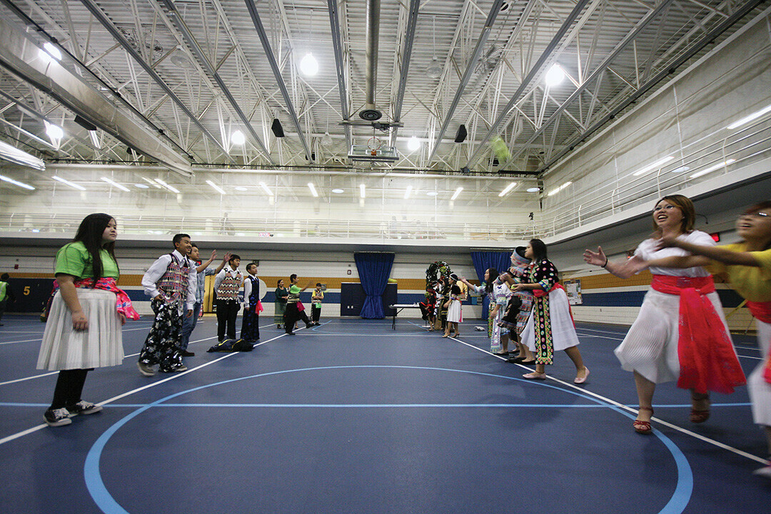 Young people played a ball-toss game – a traditional courtship ritual – at a previous Hmong New Year celebration at the mc