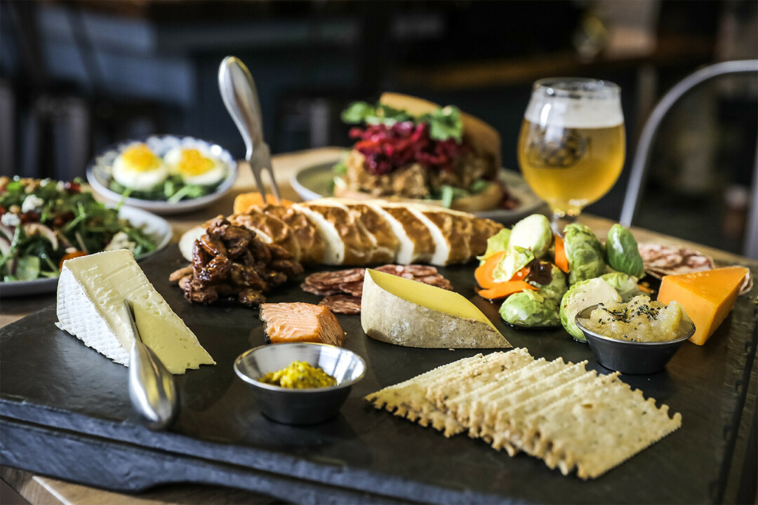 2,600 MILES OF BEER & GRUB. That's what author Heather Kerrigan did prior to pulling together her forthcoming book, Beer, Brats, and Cheese: A Wisconsin Road Trip. (3rd & Vine, Eau Claire, pictured)