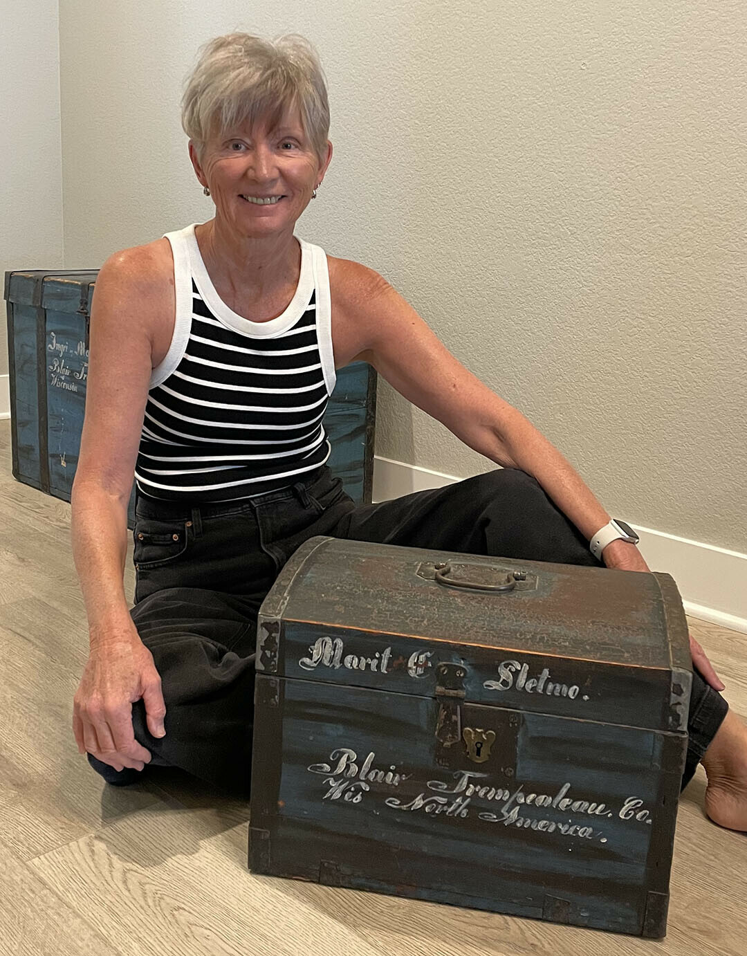 A TRUNK FULL OF MYSTERY. Eau Claire native Ann Lowry with the family heirloom trunk that inspired her debut novel. (Submitted photo)