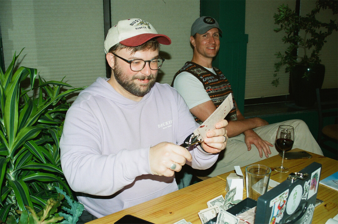 Jordan Duroe, host of Farewell Transmission Radio, hole-punches a punch card for concert attendees. Concert-goers can then bring their punch card to participating local businesses, to redeem select discounts and rewards for attending shows hosted by the radio station.