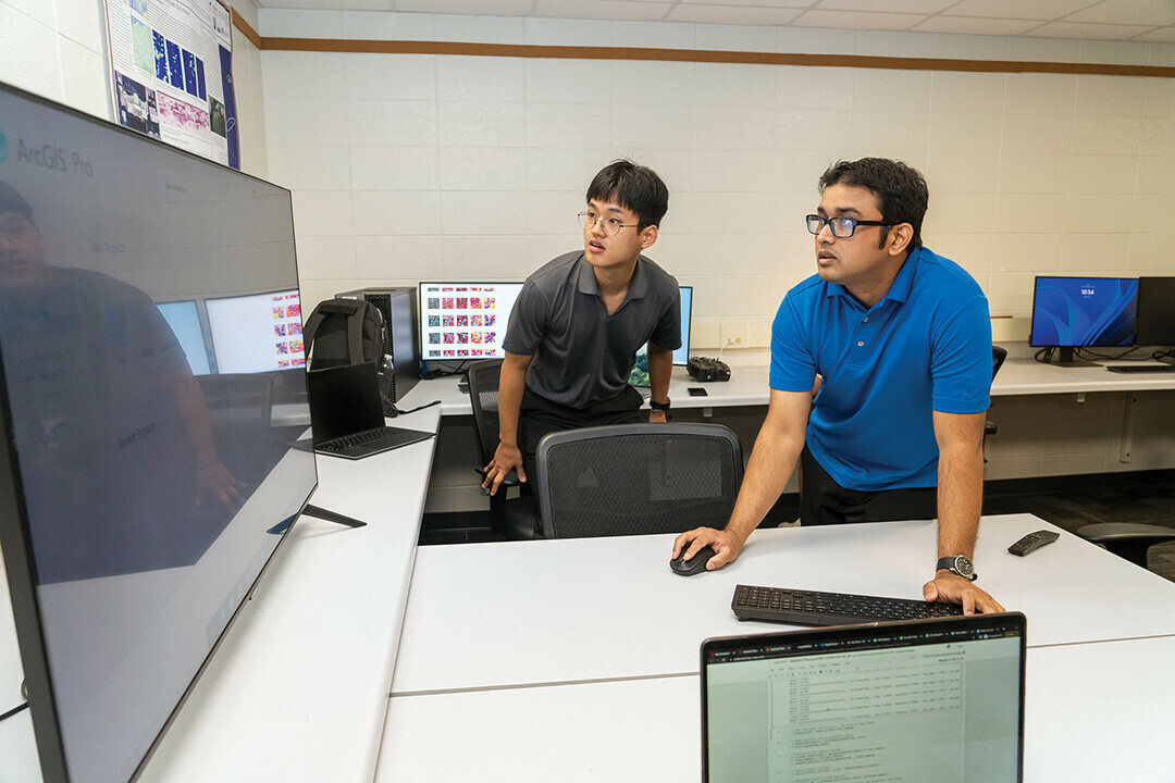 POINT AND CLICK. Dr. Rahul Gomes, right, a UWEC computer science professor, is the next speaker in the newly revived “Ask a Scientist” series on Tuesday, Dec. 10.