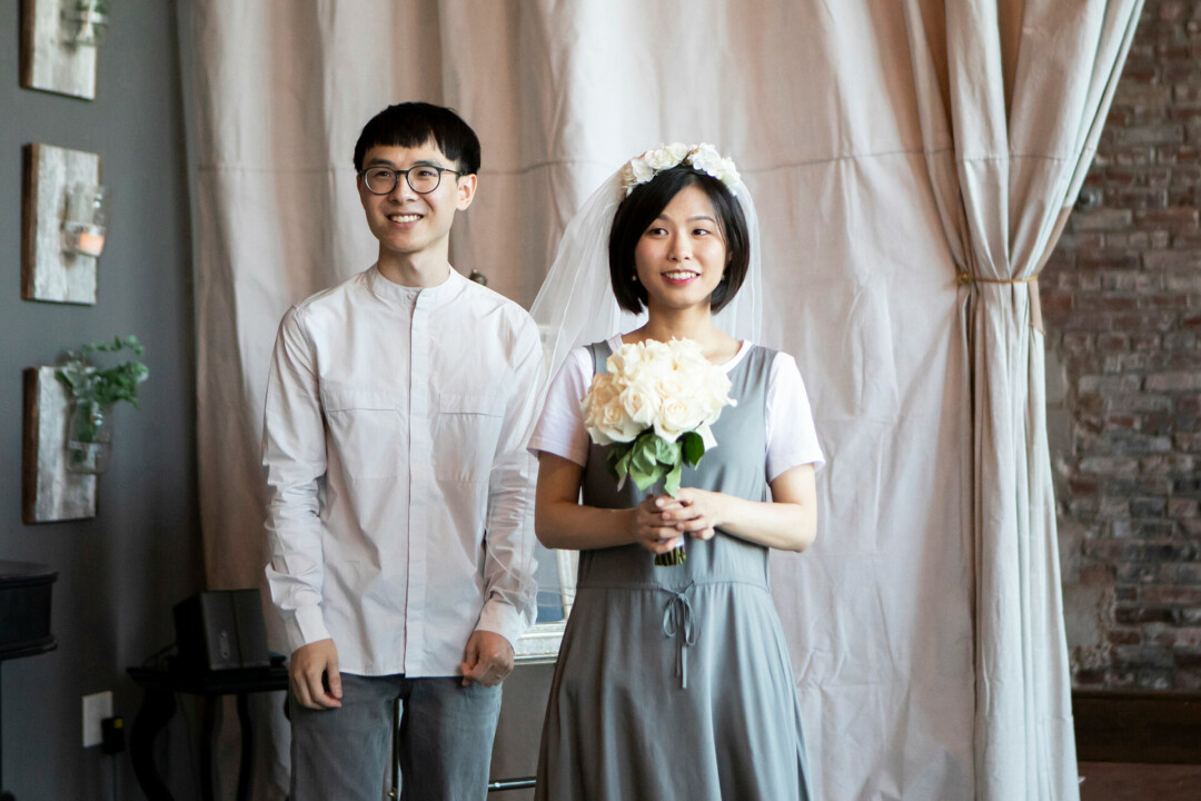 ChengOu Yu (left) and Jing Huang (right) stand together on their wedding day in Kansas City, Mo.. (Submitted photo)